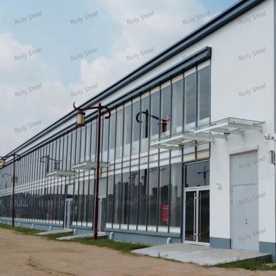 Gudang Struktur Baja Multifungsi dengan Mezzanine untuk Ruang Pamer dan Kantor